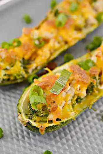 Broccoli Cheese Chicken Zucchini Boats Recipe + Photo via SWEETPEASKITCHEN.COM